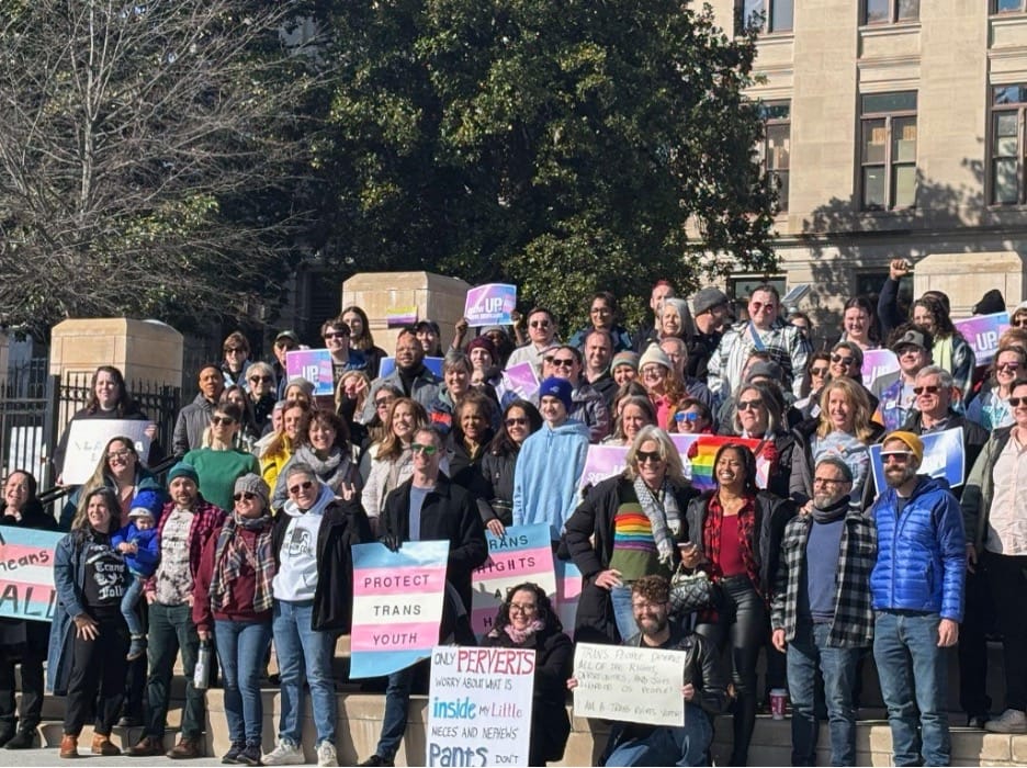 LGBTQ advocates and allies inside Liberty Plaza for the Stand Up for Trans Georgians Rally on January 13, 2025, in Atlanta, Georgia.