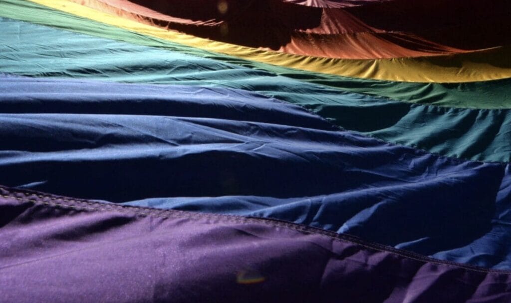 LGBTQ flag in dawn light