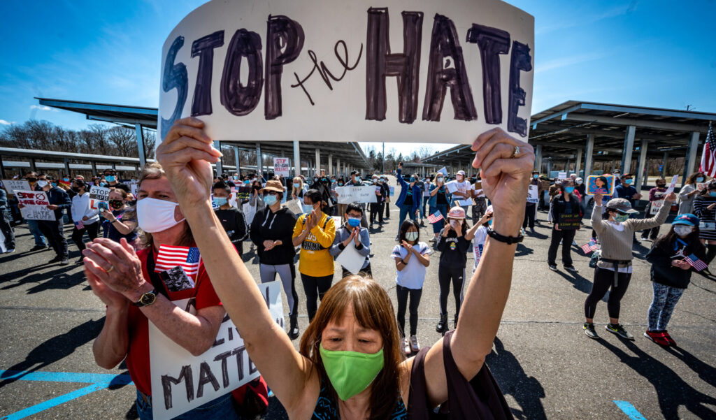 Protester with Stop the Hate sign | GLAAD Protester with Stop the Hate sign